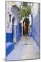 Morocco, Chaouen. Narrow Street Lined with Blue Buildings-Emily Wilson-Mounted Premium Photographic Print