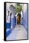 Morocco, Chaouen. Narrow Street Lined with Blue Buildings-Emily Wilson-Framed Stretched Canvas