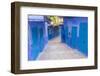 Morocco, Chaouen. Narrow Street Lined with Blue Buildings-Emily Wilson-Framed Photographic Print
