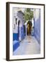 Morocco, Chaouen. Narrow Street Lined with Blue Buildings-Emily Wilson-Framed Photographic Print