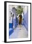 Morocco, Chaouen. Narrow Street Lined with Blue Buildings-Emily Wilson-Framed Photographic Print