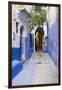 Morocco, Chaouen. Narrow Street Lined with Blue Buildings-Emily Wilson-Framed Photographic Print