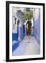 Morocco, Chaouen. Narrow Street Lined with Blue Buildings-Emily Wilson-Framed Photographic Print