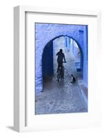 Morocco, Chefchaouen. Bicyclist Rides Past Cat in Archway in the Blue Village of Chefchaouen-Brenda Tharp-Framed Photographic Print
