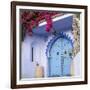 Morocco, Chefchaouen. Bougainvillea Blossoms Frame an Ornate Blue Door-Brenda Tharp-Framed Photographic Print