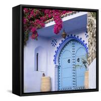 Morocco, Chefchaouen. Bougainvillea Blossoms Frame an Ornate Blue Door-Brenda Tharp-Framed Stretched Canvas