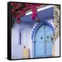 Morocco, Chefchaouen. Bougainvillea Blossoms Frame an Ornate Blue Door-Brenda Tharp-Framed Stretched Canvas