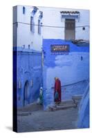 Morocco, Chefchaouen. Women Walking the Cobblestone Streets-Brenda Tharp-Stretched Canvas