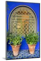Morocco, Marrakech, Blue Building Exterior Surrounded by Plants-Emily Wilson-Mounted Photographic Print