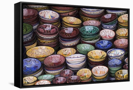 Morocco, Marrakech. Colorfully painted ceramic bowls for sale in a souk, a shop.-Brenda Tharp-Framed Stretched Canvas