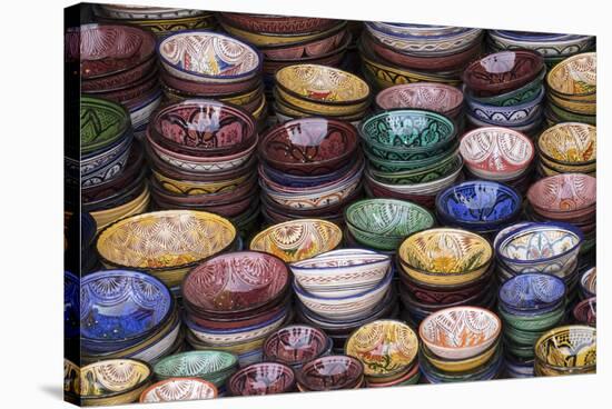 Morocco, Marrakech. Colorfully painted ceramic bowls for sale in a souk, a shop.-Brenda Tharp-Stretched Canvas