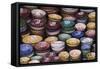 Morocco, Marrakech. Colorfully painted ceramic bowls for sale in a souk, a shop.-Brenda Tharp-Framed Stretched Canvas