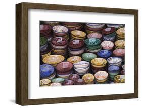 Morocco, Marrakech. Colorfully painted ceramic bowls for sale in a souk, a shop.-Brenda Tharp-Framed Photographic Print