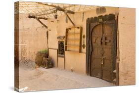 Morocco, South of Morocco, Traditionally Carved Wood Door at Tamnougalt Kasbah in the Draa Valley-Emily Wilson-Stretched Canvas