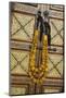 Morocco, Tinerhir. Traditional necklace of Berber woman hangs on a cabinet with camel-bone inlay-Brenda Tharp-Mounted Photographic Print