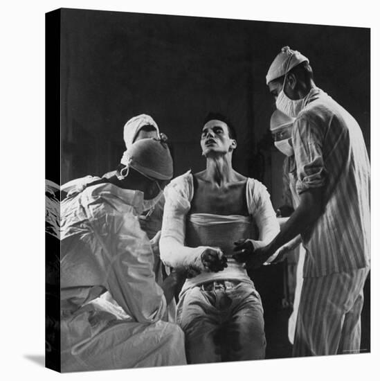 Mortar Wounded Army Medic Private George Lott, Sitting Up While 4 Army Surgeons Finish Up His Cast-Ralph Morse-Stretched Canvas