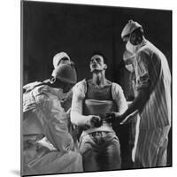 Mortar Wounded Army Medic Private George Lott, Sitting Up While 4 Army Surgeons Finish Up His Cast-Ralph Morse-Mounted Photographic Print