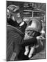 Mother and Baby Wearing Gas Masks During Gas Preparations Test During WWII-Hans Wild-Mounted Premium Photographic Print