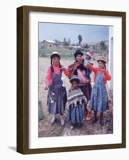 Mother and Four Children Wearing Derby Hats, Playing with Ball of Yarn, Andean Highlands of Bolivia-Bill Ray-Framed Premium Photographic Print