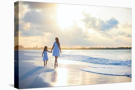 Mother and Her Little Daughter Walking along a Beach on Sunset-BlueOrange Studio-Stretched Canvas