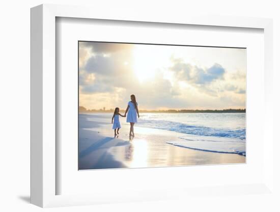 Mother and Her Little Daughter Walking along a Beach on Sunset-BlueOrange Studio-Framed Photographic Print