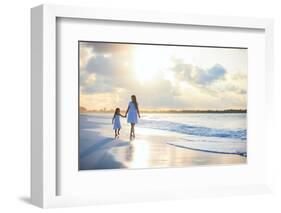 Mother and Her Little Daughter Walking along a Beach on Sunset-BlueOrange Studio-Framed Photographic Print