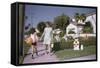 Mother and Son Walking by Christmas Decorations on Yards-William P. Gottlieb-Framed Stretched Canvas