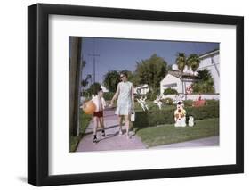 Mother and Son Walking by Christmas Decorations on Yards-William P. Gottlieb-Framed Photographic Print