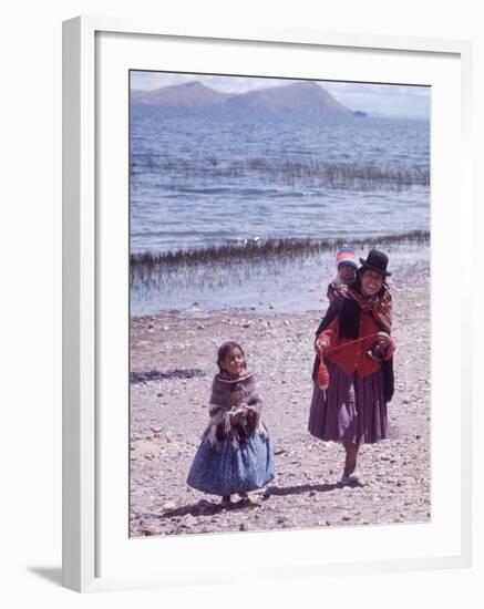 Mother and Two Children Holding Ball of Yarn, Andean Highlands of Bolivia-Bill Ray-Framed Photographic Print