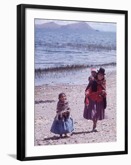 Mother and Two Children Holding Ball of Yarn, Andean Highlands of Bolivia-Bill Ray-Framed Photographic Print