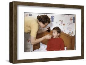 Mother Giving Her Son Medicine-William P. Gottlieb-Framed Photographic Print