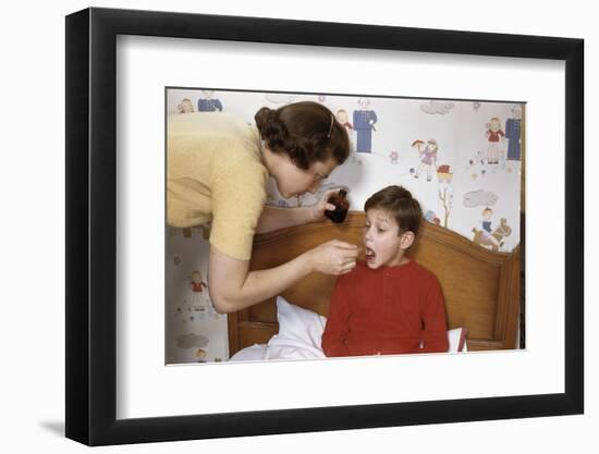 Mother Giving Her Son Medicine-William P. Gottlieb-Framed Photographic Print