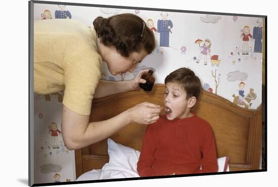 Mother Giving Her Son Medicine-William P. Gottlieb-Mounted Photographic Print