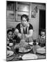 Mother Serving Spaghetti to Her Children-null-Mounted Photographic Print