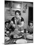 Mother Serving Spaghetti to Her Children-null-Mounted Photographic Print