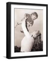 Mother Swinging Daughter up in the Air-Philip Gendreau-Framed Photographic Print