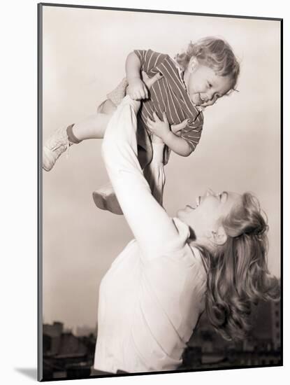 Mother Swinging Daughter up in the Air-Philip Gendreau-Mounted Photographic Print
