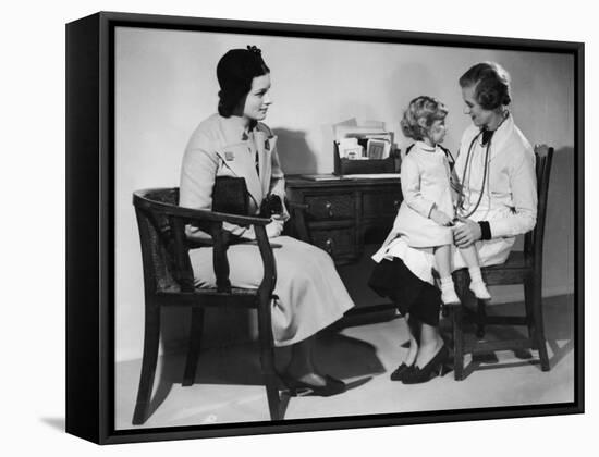 Mother Takes Her Little Girl to a Female Doctor for a Routine Examination-null-Framed Stretched Canvas