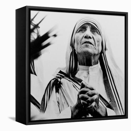 Mother Teresa of Calcutta Prays During a Religious Service-null-Framed Stretched Canvas