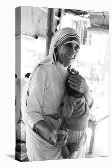 Mother Teresa with a Baby-null-Stretched Canvas