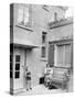 Mother with Her Two Sons in the Courtyard of their German Home, Ca. 1946-null-Stretched Canvas