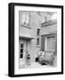 Mother with Her Two Sons in the Courtyard of their German Home, Ca. 1946-null-Framed Photographic Print