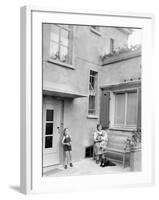 Mother with Her Two Sons in the Courtyard of their German Home, Ca. 1946-null-Framed Photographic Print