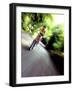 Motion Blurred Image of a Female Cyclist-null-Framed Photographic Print