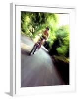 Motion Blurred Image of a Female Cyclist-null-Framed Photographic Print