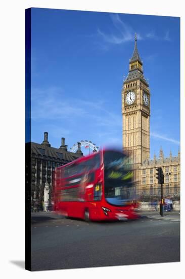 Motion Blurred Red London Bus Below Big Ben-Stuart Black-Stretched Canvas