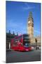 Motion Blurred Red London Bus Below Big Ben-Stuart Black-Mounted Photographic Print