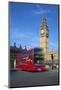 Motion Blurred Red London Bus Below Big Ben-Stuart Black-Mounted Photographic Print