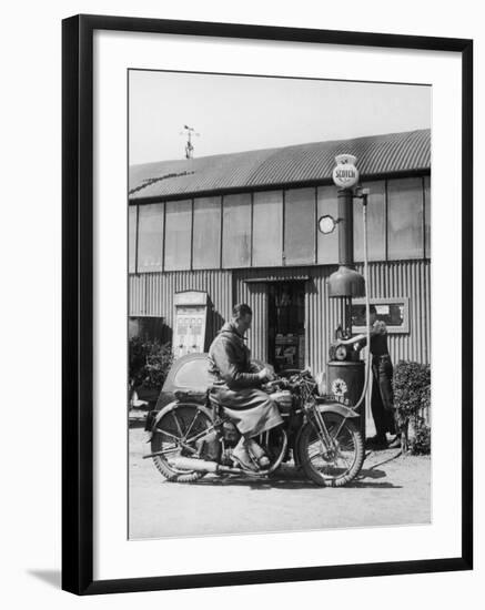 Motor Cycle Rider Stops at a Garage in Scotland for Petrol Sitting-null-Framed Photographic Print