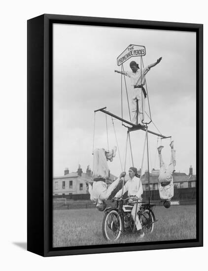 Motorcycle Acrobat Troupe Called "The Promenade Percies" Practise Their Act Involving Balance-null-Framed Stretched Canvas